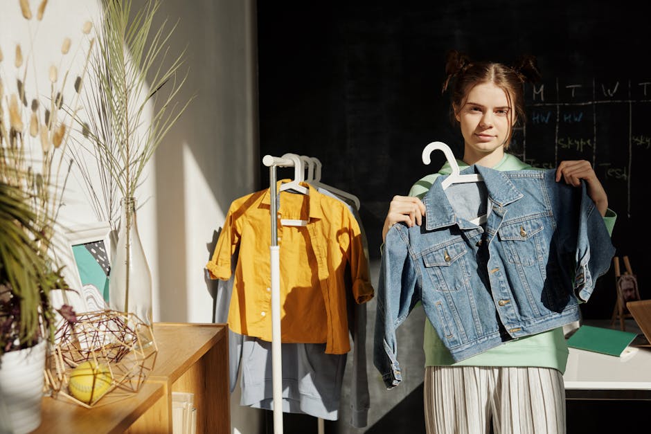 Teen girl indoors showcasing denim jacket in bright, stylish setting. Perfect for fashion marketing.