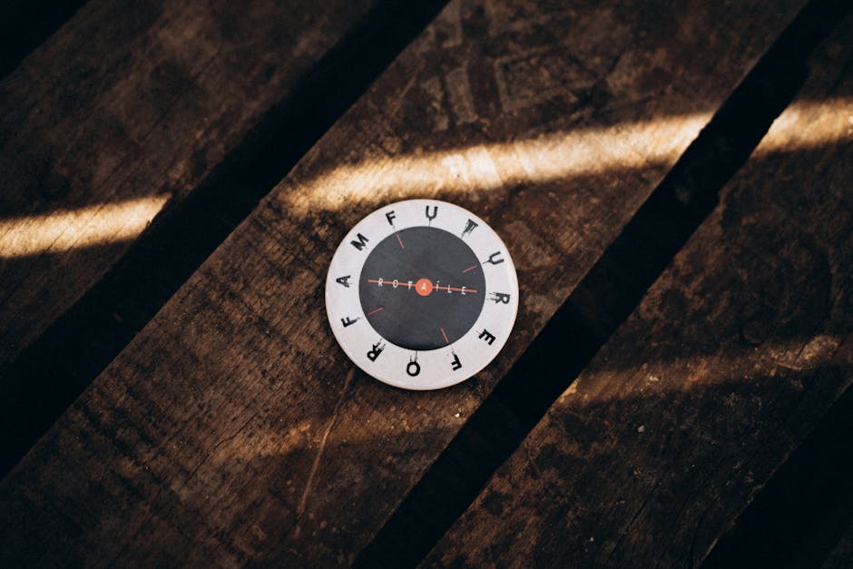Circular disk on a rustic wooden table with sunlight casting shadows.